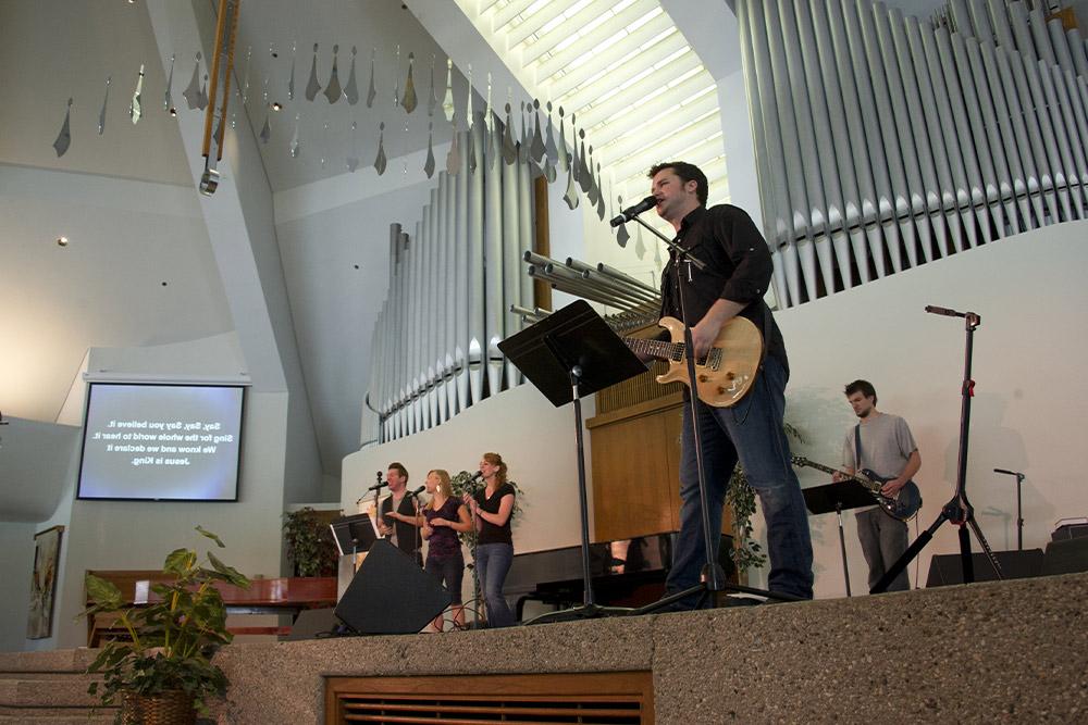A band leads worship in the CU Center.