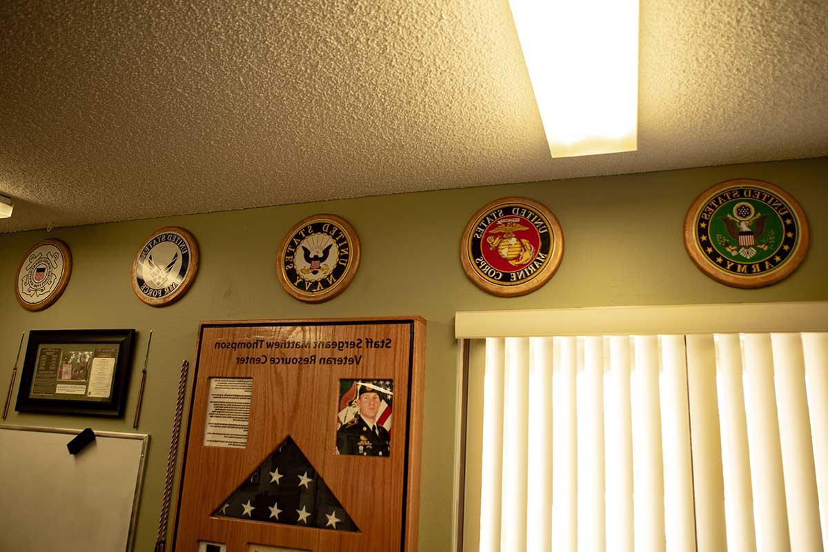Military branches hanging on the wall